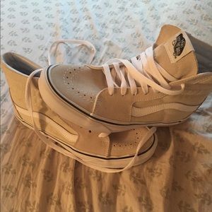 cream and white high top vans